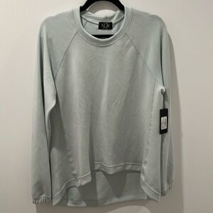 Nux Sweatshirt. Hi-low hem